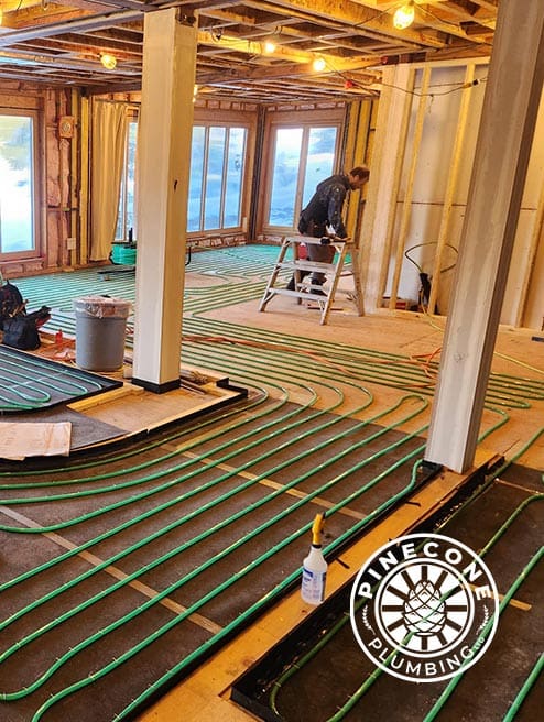 Plumbing service technician in Whistler performing repairs