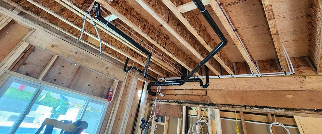 reliable plumber inspecting plumbing system